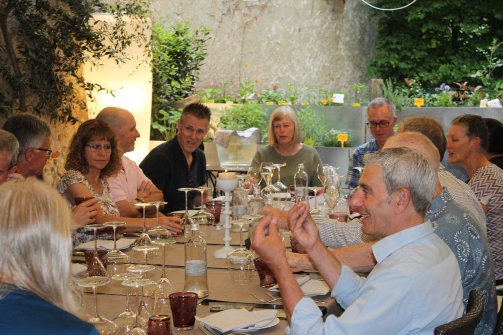 Guests enjoying dinner together during a Bikestyle Tours cycling holiday